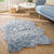 Tapis poils forme peau de b&ecirc;te (bleu glacier)