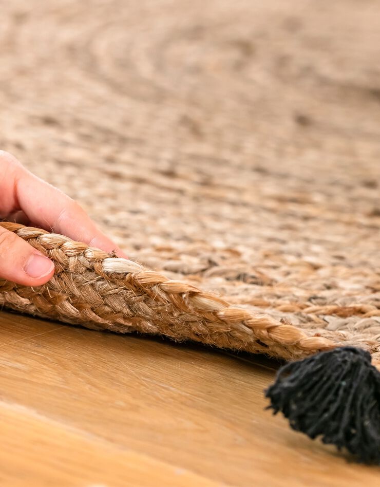 Tapis rond en jute avec pompons de couleur (noir)