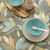 Nappe toile cirée imprimé feuillage (marron / turquoise)