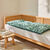 Long coussin de sol imprimé feuillage (amande)