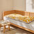 Long coussin de sol imprim&eacute; feuillage (miel)