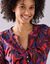 Tunique col boutonné imprimé floral (rouge / violet)