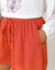 Short cr&eacute;pon uni, effet jupette (paprika)