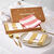 Coffret de 4 serviettes de table en coton, brod&eacute;es (rose + jaune)