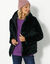 Veste fausse fourrure réversible en doudoune (noir)