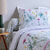 Linge de lit Julie en coton imprimé herbier (blanc / rose)
