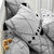 Linge de lit Massaï coton à motifs graphiques et finitions pompons (gris)