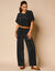 Pantalon large uni, maille plissée (noir)