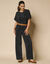 Pantalon large uni, maille plissée (noir)